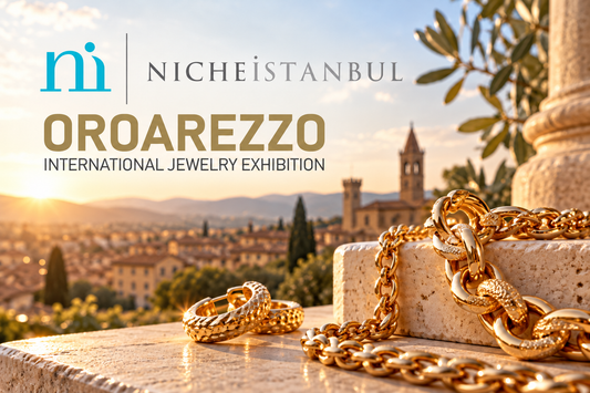 Oroarezzo and Niche Istanbul logos over an illustration of gold jewelry and the Tuscan landscape